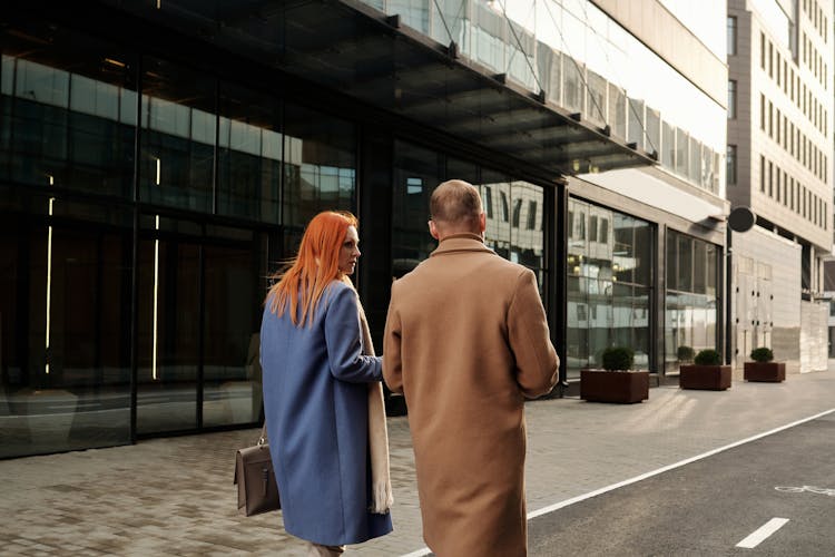 Man And Woman Walking On The Street