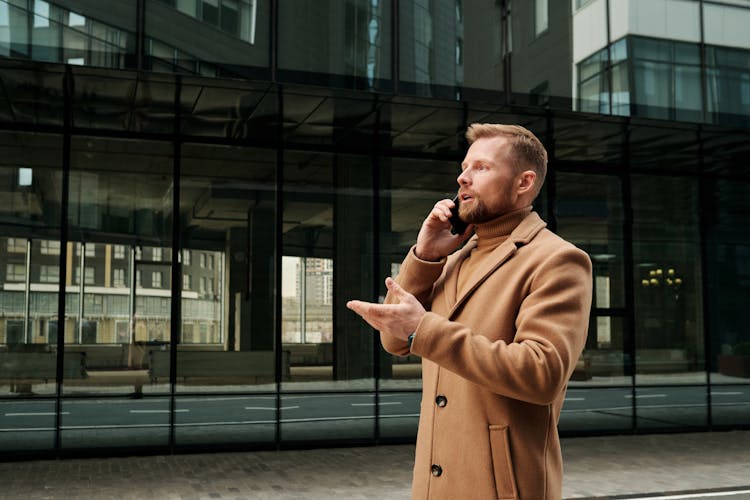 A Businessman Talking On The Phone 