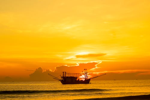 Ship on Body of Water During Dusk