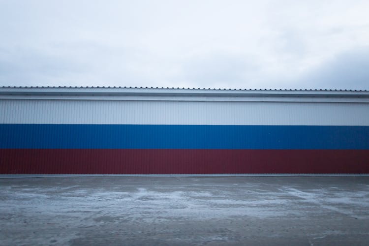 Red Blue And White Stripes On Urban Building