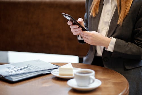 A Businesswoman Browsing Her Smartphone