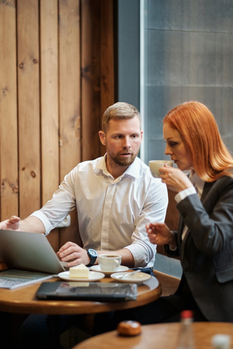 Colleagues Having A Meeting In A Coffee Shop