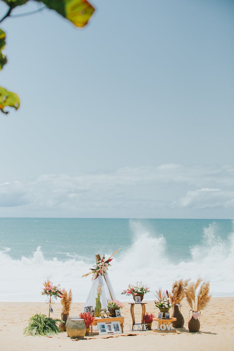 Figures On Sand Beach On Ocean Background