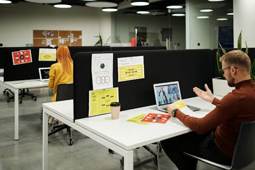 Colleagues working and collaborating virtually at a stylish modern office workspace.