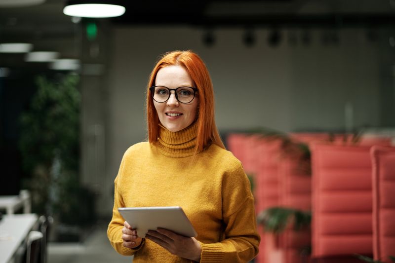 Portrait of woman in yellow turtleneck sweater