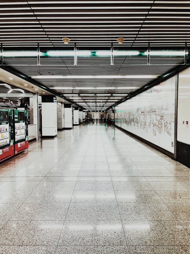 Symmetrical Shot Of An Empty Shopping Mall Corridor 