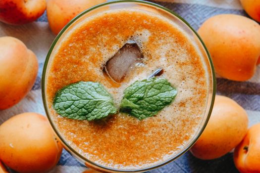 Glass of fresh cocktail with apricots