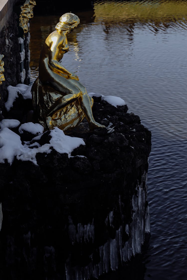 Statue Of Neva Near Calm River