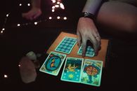 Crop woman with tarot cards