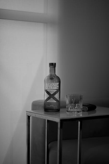 Bottle of vodka on table · Free Stock Photo
