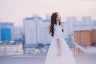 Photo of a Woman in White Dress