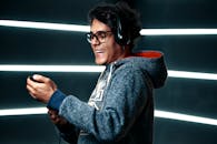 A Man in Gray Hoodie Wearing Black Headphones