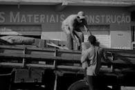 Men loading bags on truck