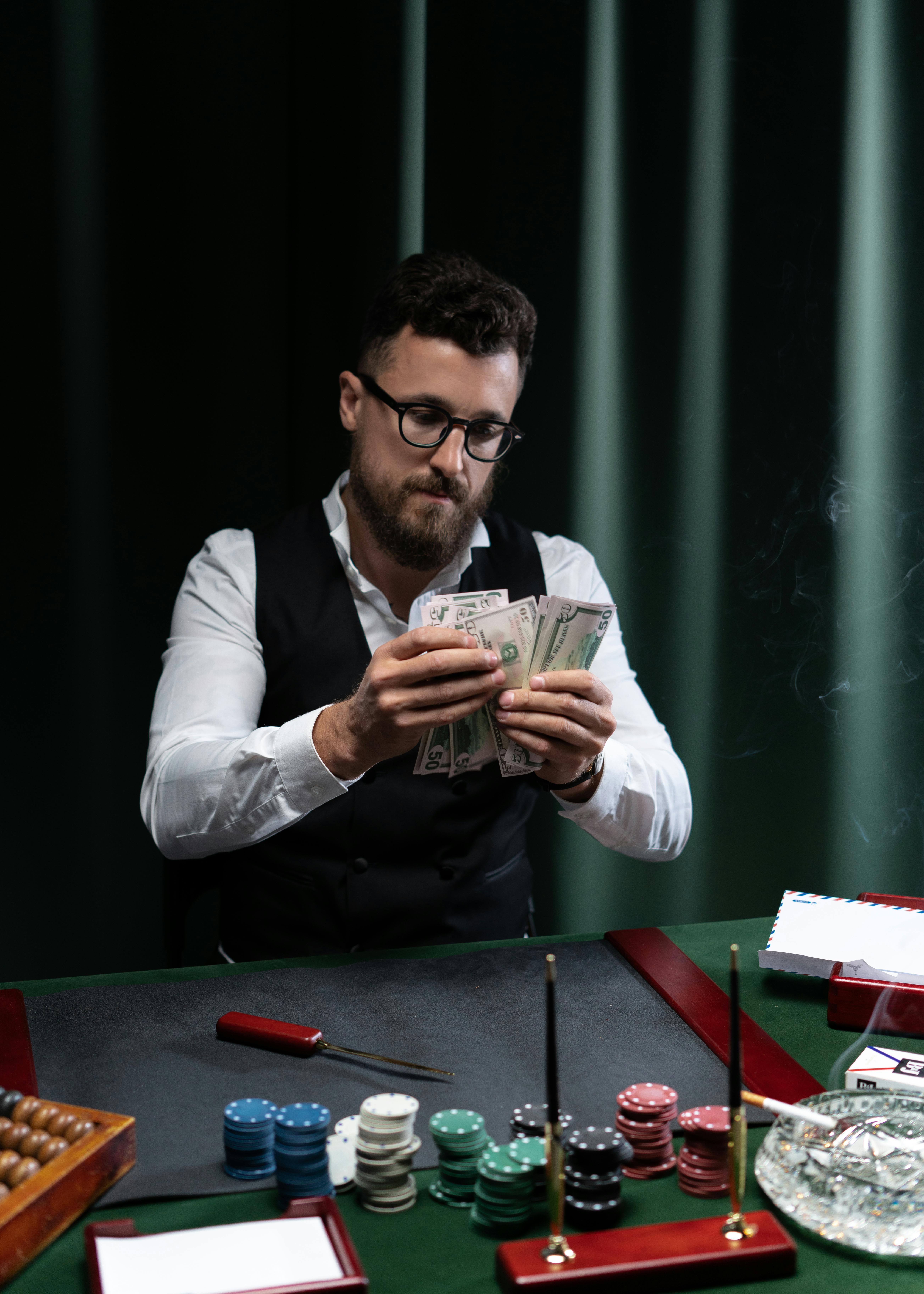 bearded man counting money