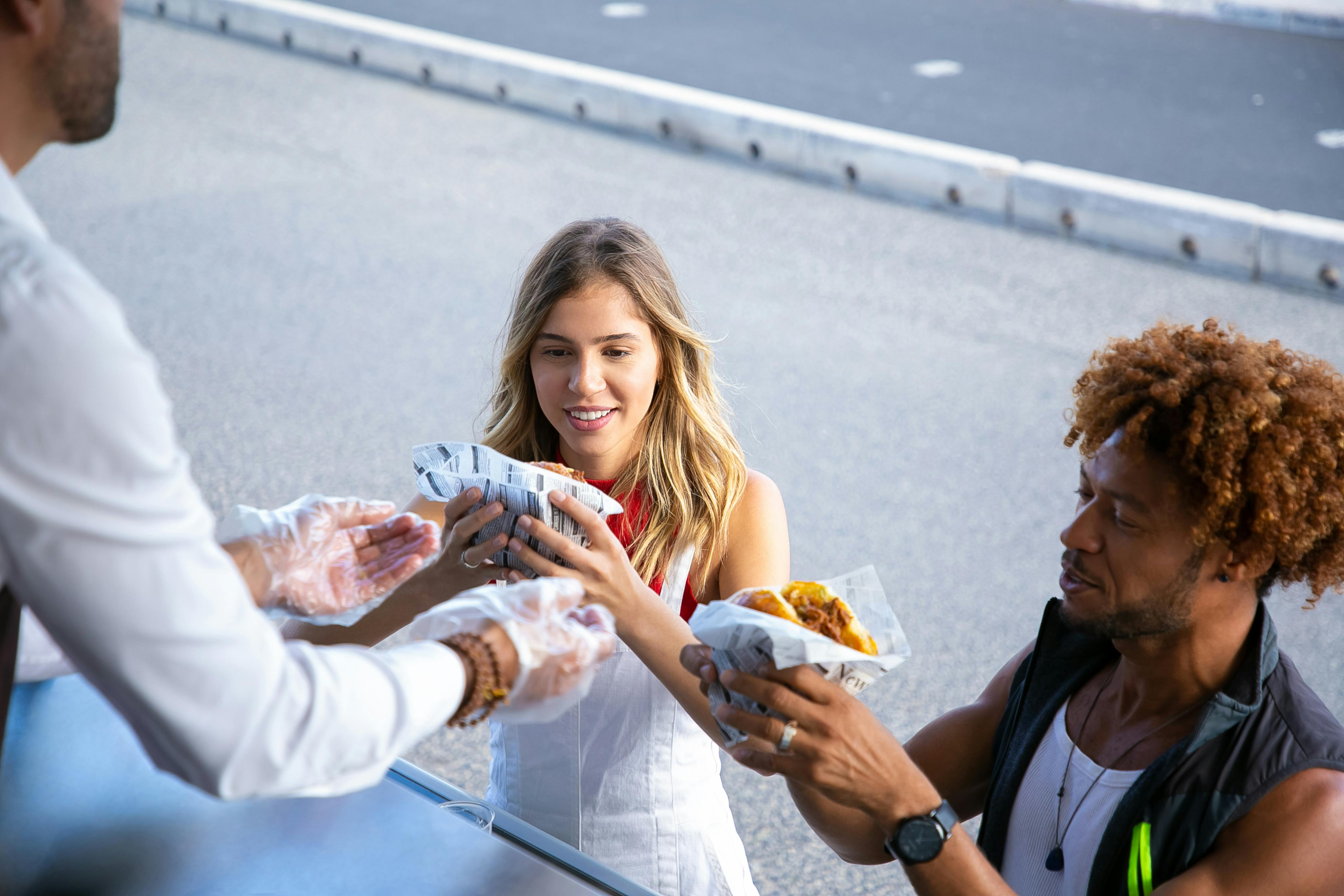 seller giving order to multiethnic couple