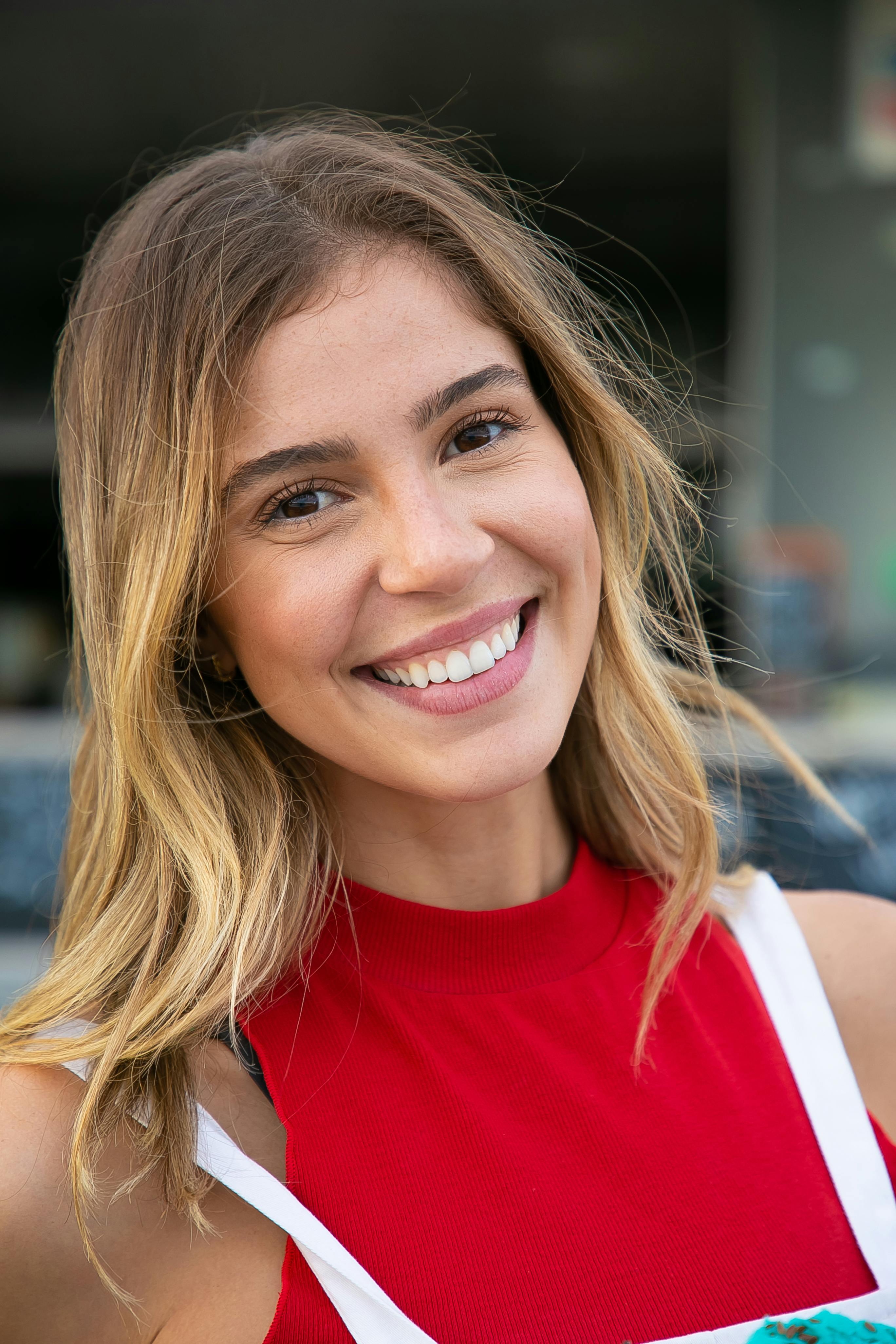 attractive woman standing near food truck in park