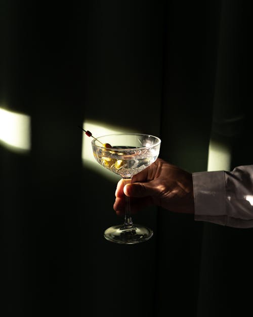 A Person Holding a Cocktail Drink