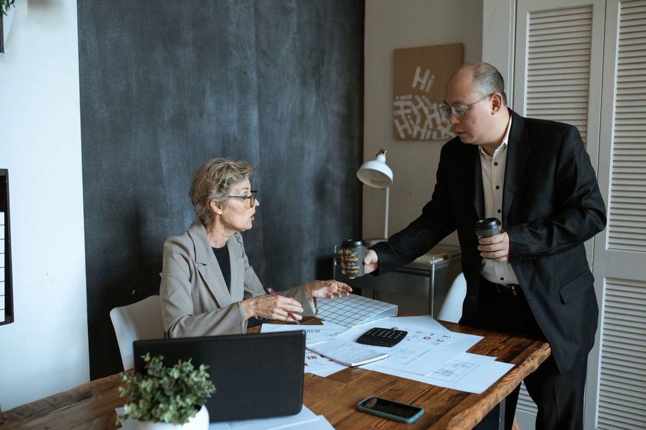 Business consultation between small business owner and IT consultant Business consultation between small business owner and IT consultant
