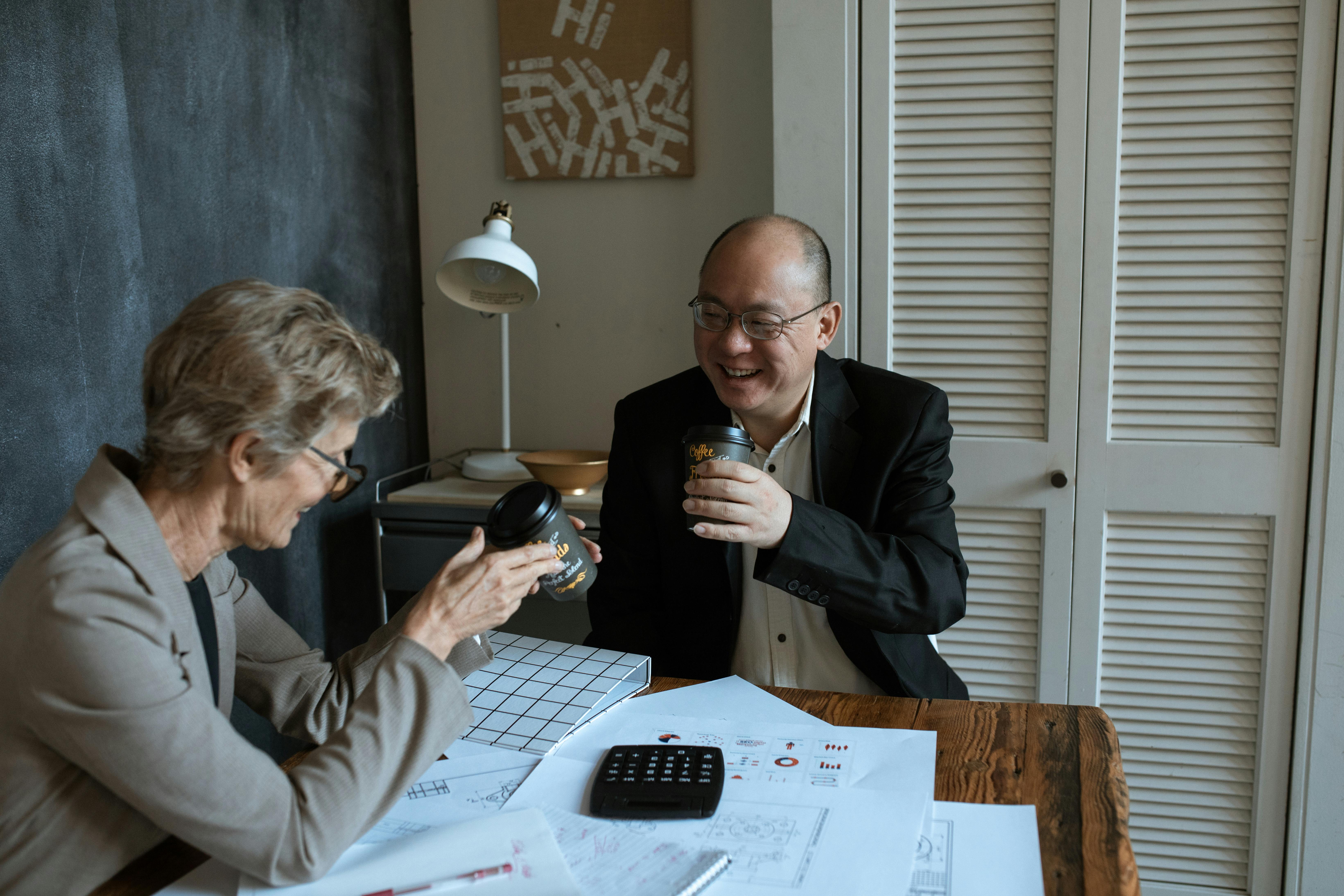 a man and a woman drinking coffee