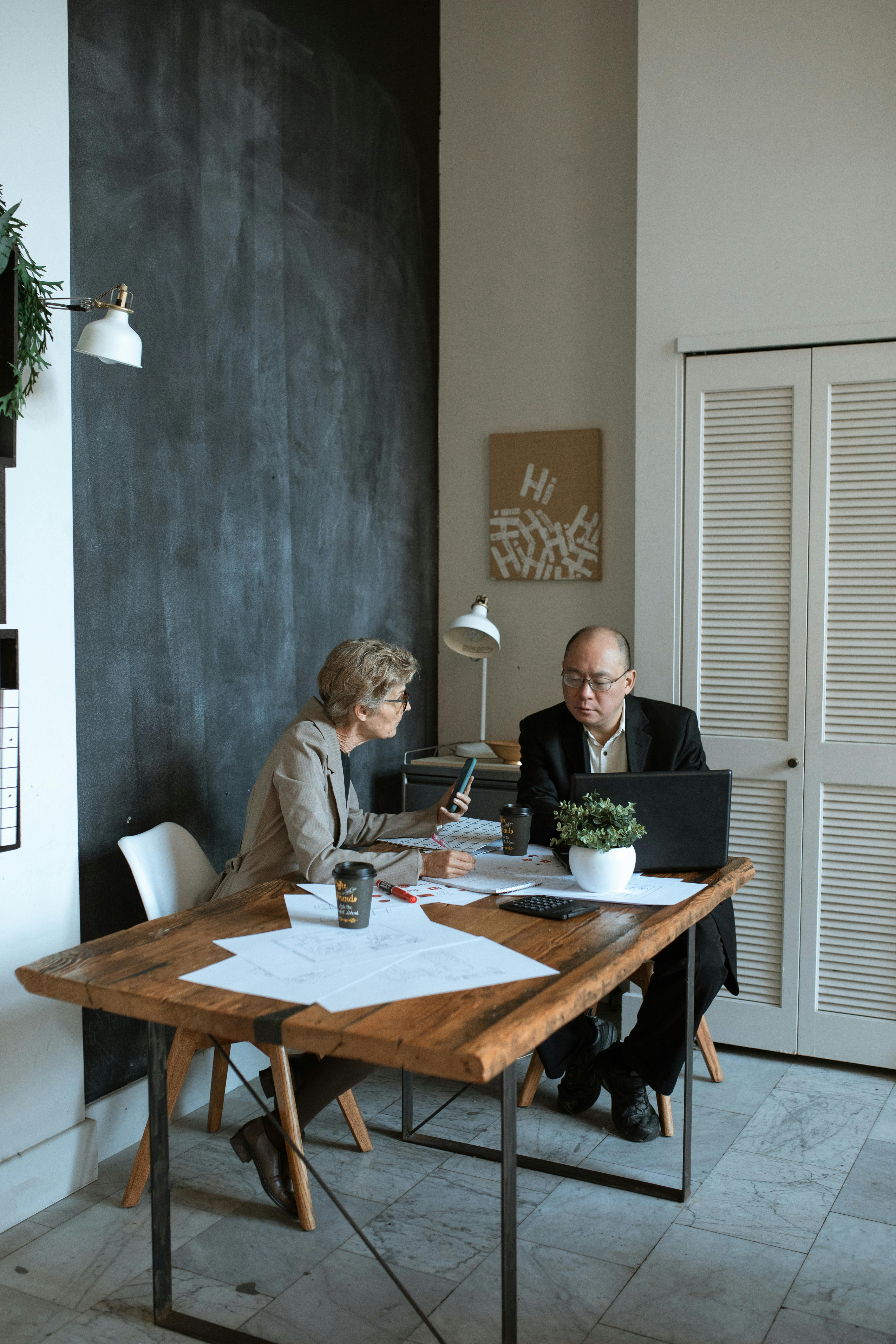 man and woman sitting at table