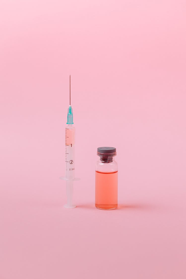 Vaccine On Pink Surface