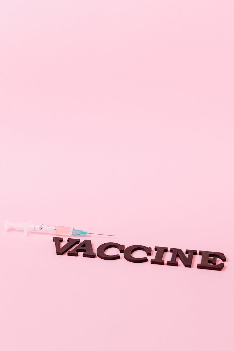 Covid Vaccine On Pink Surface