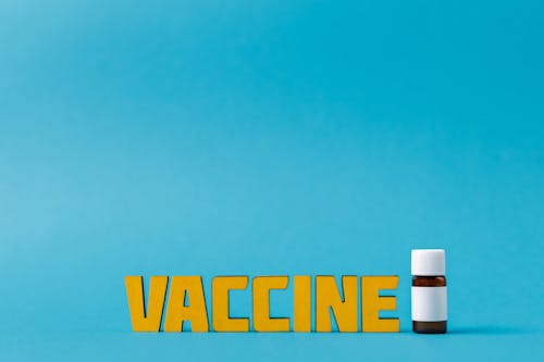 Vaccine Text Beside A Bottle