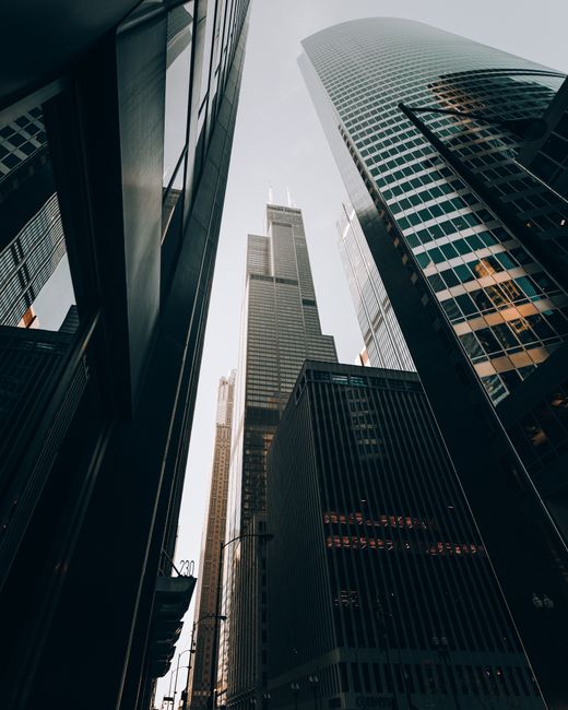 A breathtaking low-angle shot of Chicago's towering skyscrapers under a clear sky.