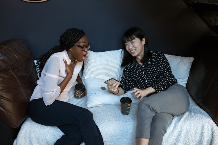 Women Sitting On Bed