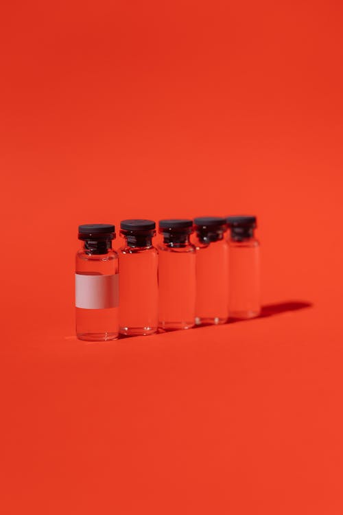 Vials On Red Surface
