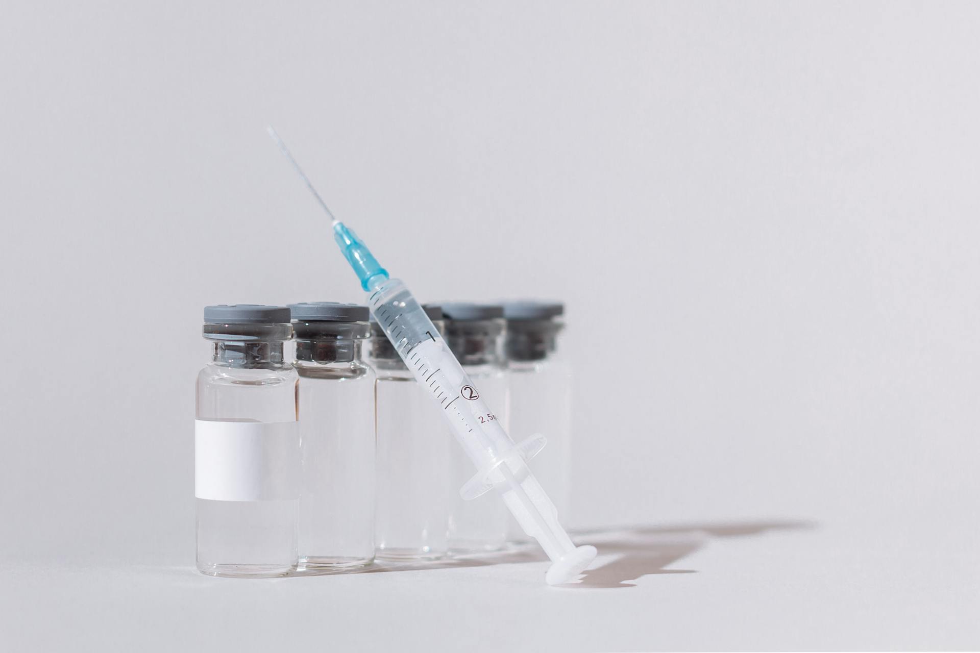 Covid Vaccine Bottles and Syringe