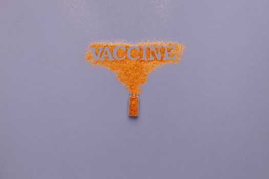 橙色闪光从灰色背景的小瓶中流出，形成“疫苗”一词