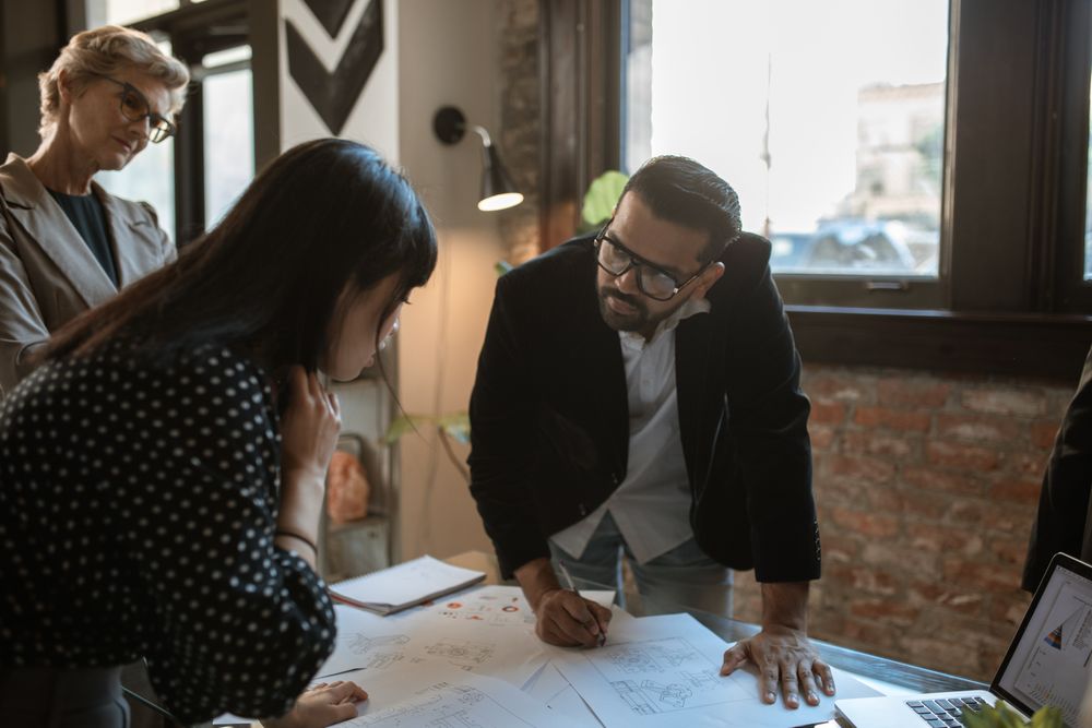 Team members engaged in a creative office brainstorming session