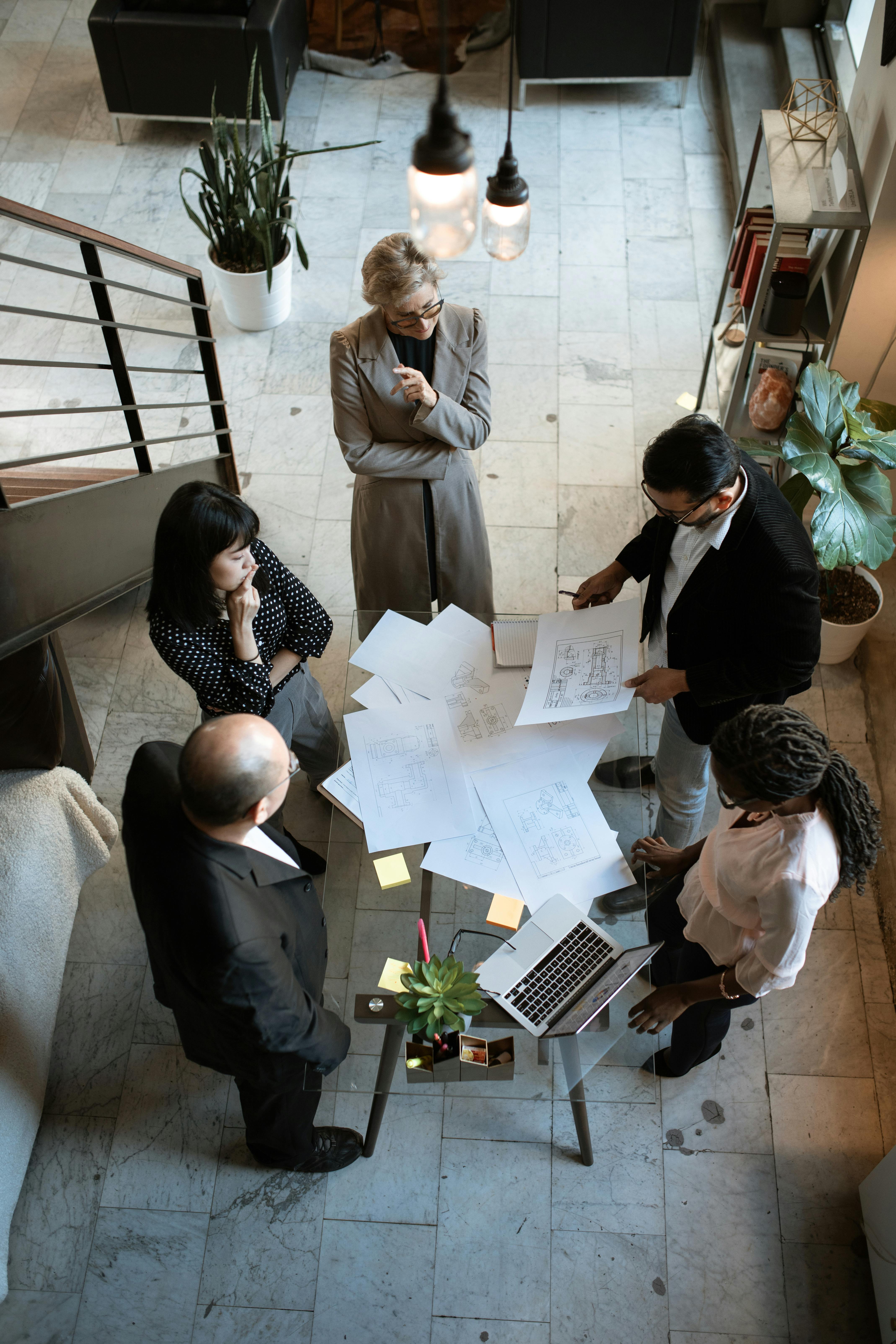 people sitting on chair in front of table