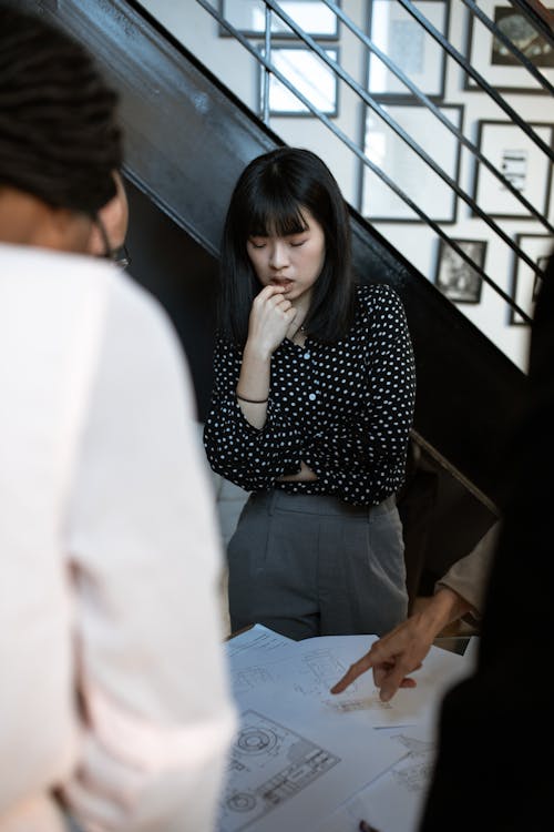 A Woman in Black and White Polka Dot Long Sleeves