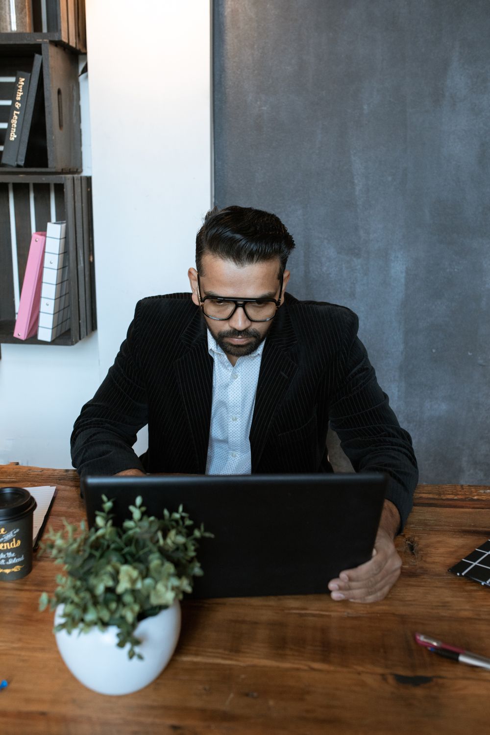 Man in Black Suit Jacket Using Black Laptop Computer · Free Stock Photo