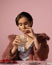 Woman in Black Tank Top Holding Drinking Glass