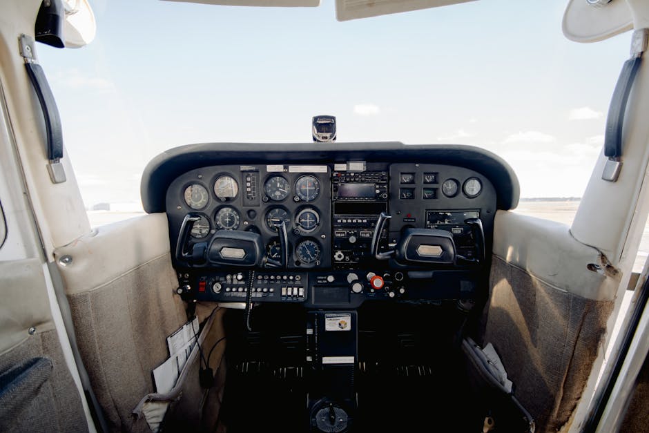 Interior of cabin with dashboard consisting of steering wheel sensors and buttons for aircraft control