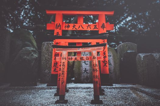 Captivating view of traditional red Torii gates at Fushimi Inari Shrine in Kyoto, Japan.