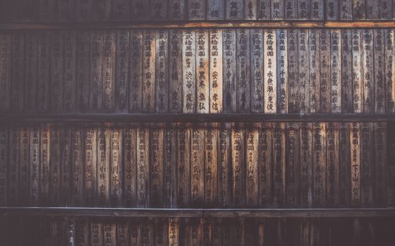 Wooden prayer plaques with Japanese calligraphy in a Kyoto shrine, Japan.