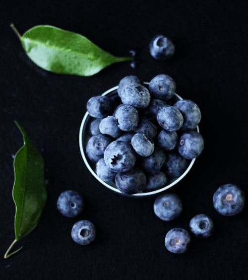 Green Leaves Beside Blueberries