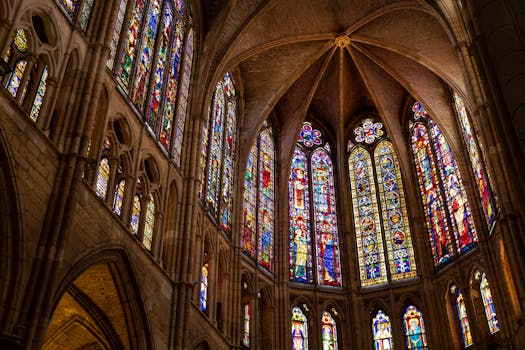 Intricate stained glass windows in the Gothic cathedral of León, Spain.
