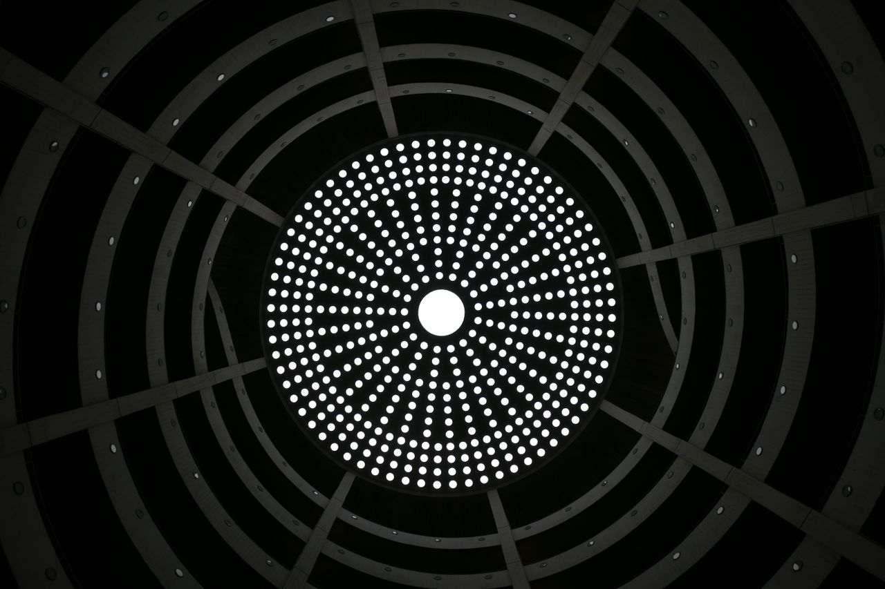artistic circular pattern in a modern ceiling with symmetrical light d