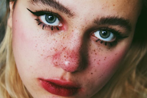 Woman With Blue Eyes and Black Eye Shadow