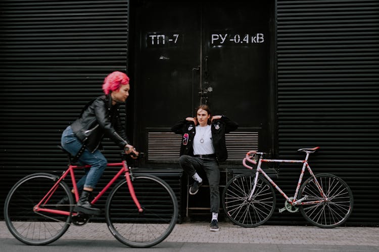 Woman Riding A Red Bicycle