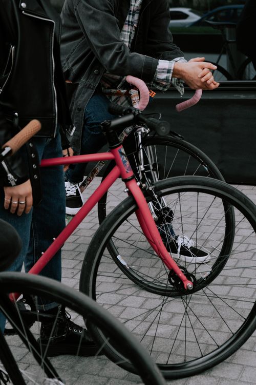 Free Close-up of cyclists on fixie bikes in urban setting, capturing modern lifestyle. Stock Photo