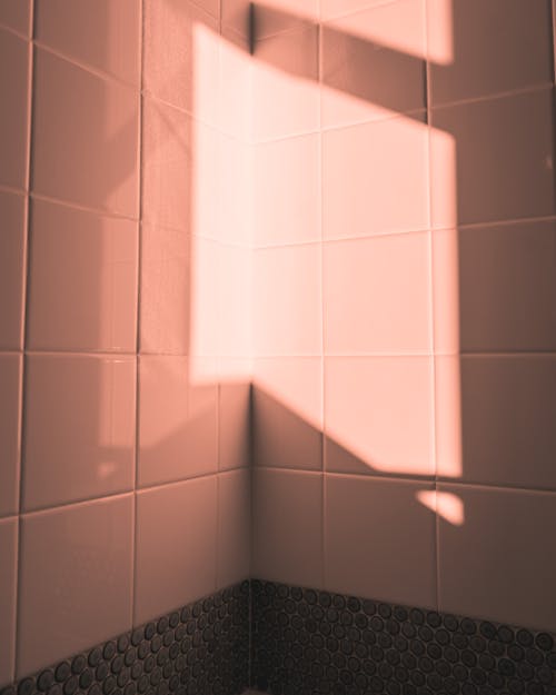 Free Sunlight Reflecting on Tiles in Corner of Room Stock Photo