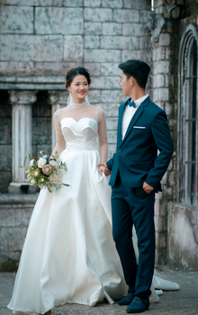 A beautiful couple embraces on their wedding day, showcasing love and elegance.