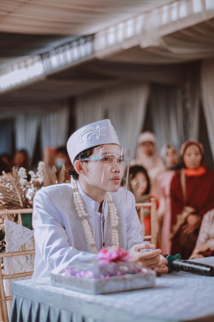 A Groom Wearing A Face Shield