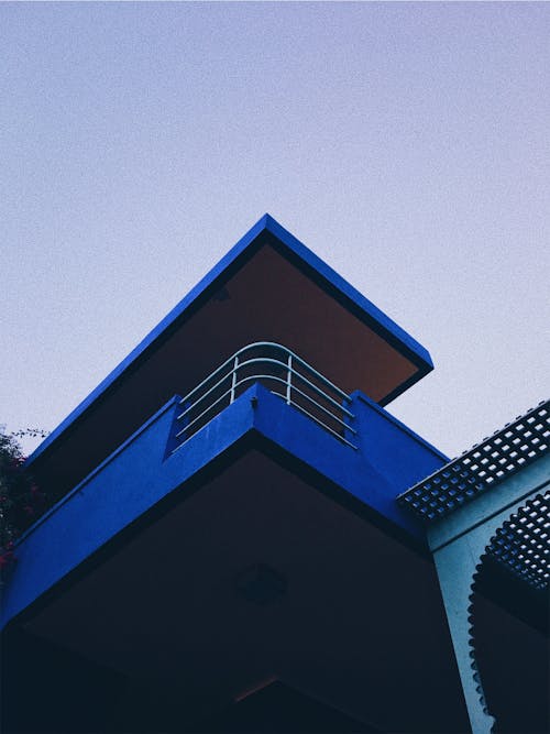 Low Angle Photography of Blue Concrete Building ]